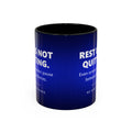 A white ceramic mug with a coloured handle and matching inner glaze, printed the whole way around in deep navy blue that brightens to electric cobalt. Large white capitals read REST IS NOT QUITTING, with the line Even screen readers pause between sentences beneath it, then a small silver ring with a bright centre, and NO SIGHT REQUIRED in small widely spaced capitals.