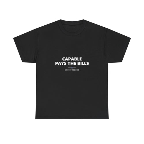 A dark t-shirt printed across the chest in large heavy white capitals on two lines: CAPABLE PAYS THE BILLS. Beneath it, two short white rules run either side of a small ring with an electric-blue inner circle and a white centre, and NO SIGHT REQUIRED sits below in small widely spaced capitals.